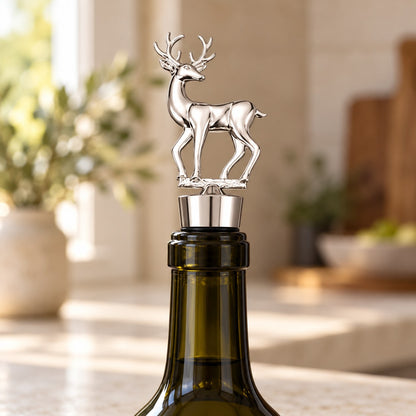 Silver deer wine stopper on an opened wine bottle