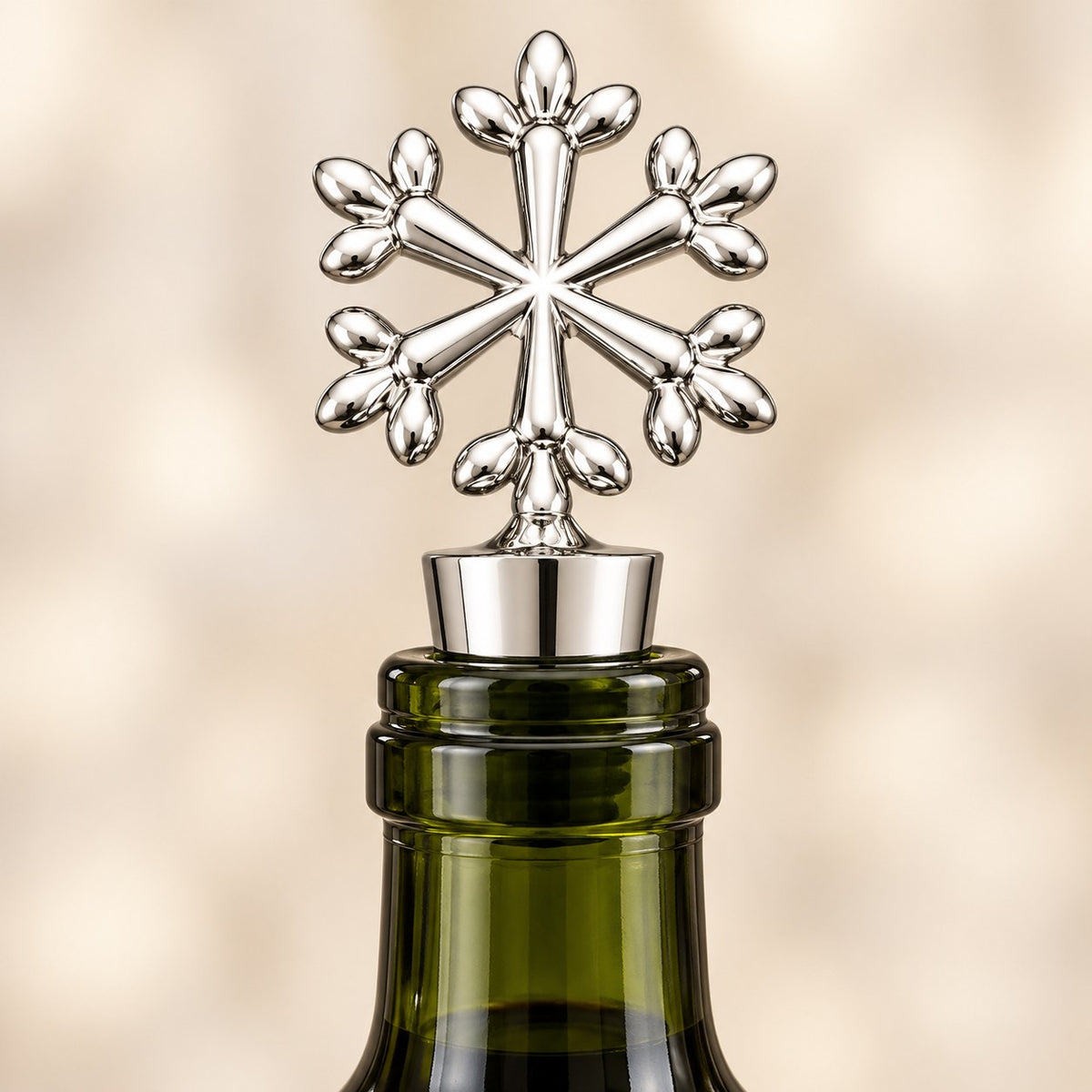 Silver snowflake wine stopper on an opened wine bottle