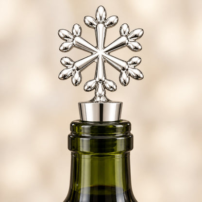 Silver snowflake wine stopper on an opened wine bottle